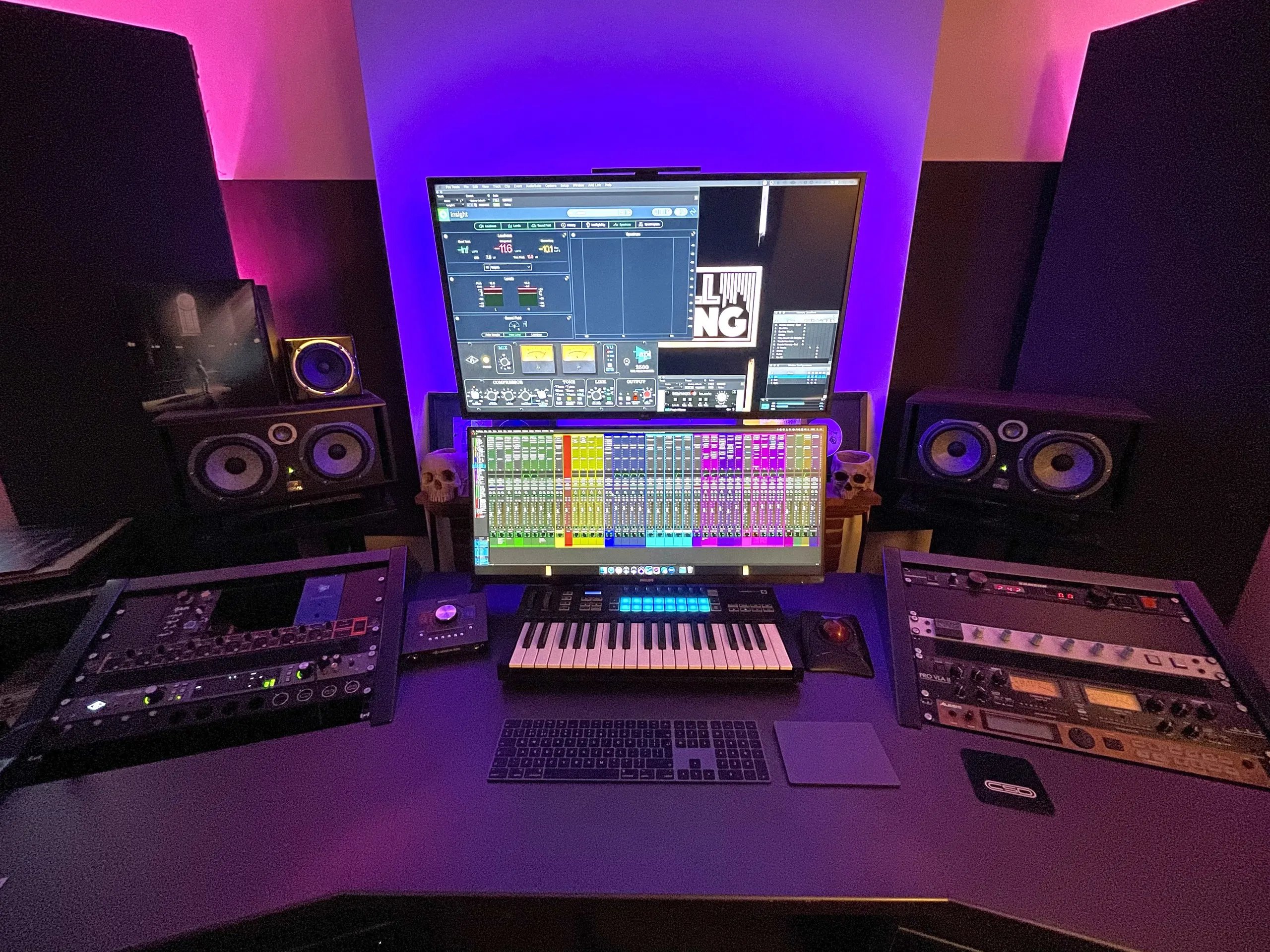 Studio desk with monitors, screen and keyboard
